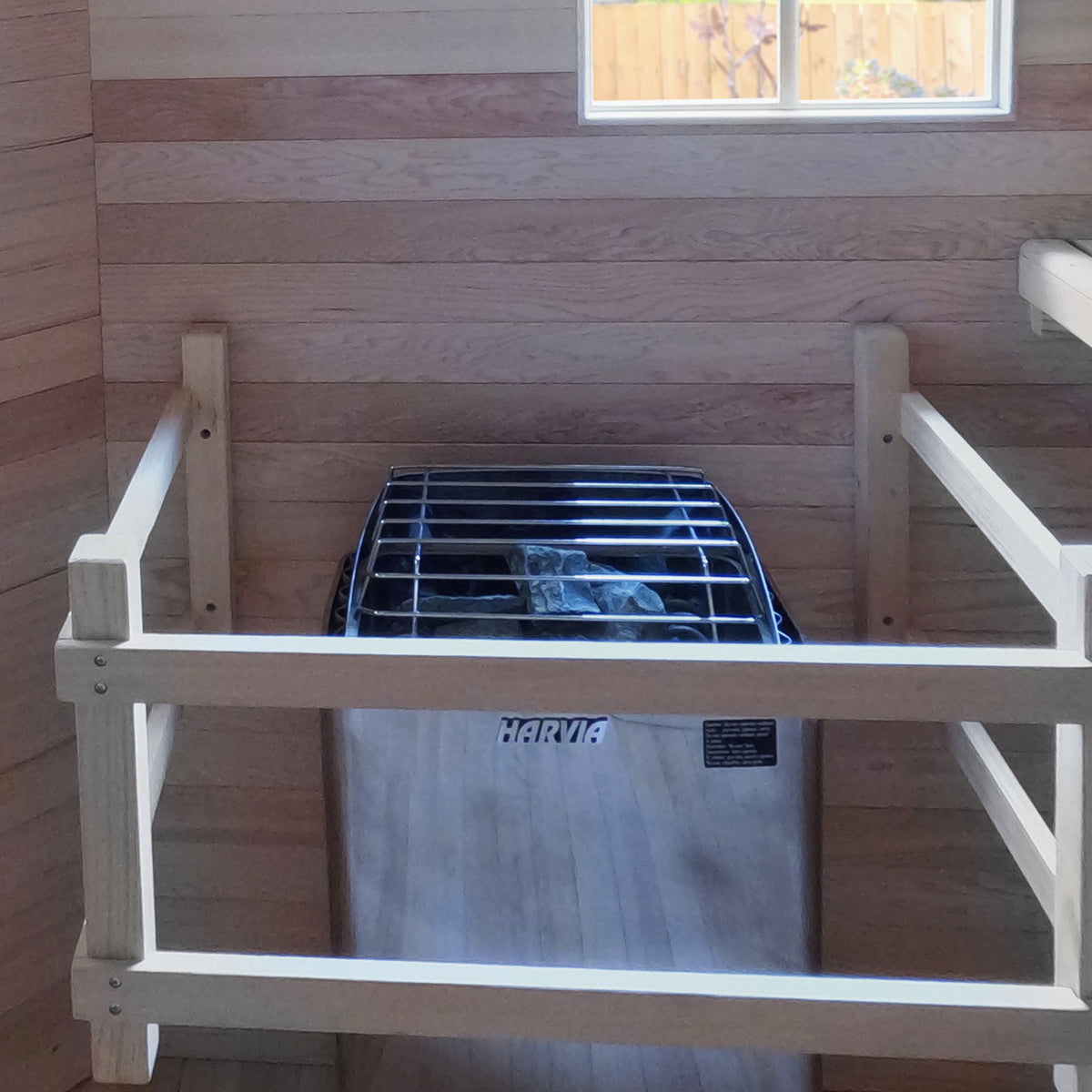 8 kW Electric Sauna Heater installed in an Aleko Canadian Red Cedar Wet/Dry Outdoor Sauna with Asphalt Roof 8 Person.