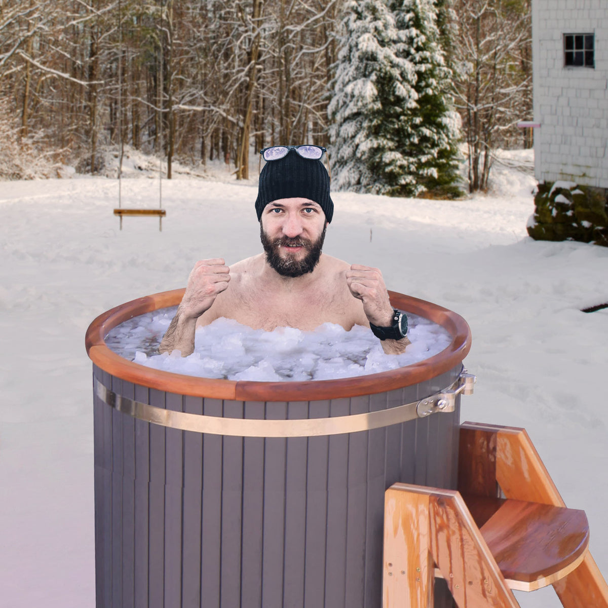 A man having a cold therapy session in a Aleko Outdoor Wooden Ice Bath Cold Plunge Tub filled with water and ice.