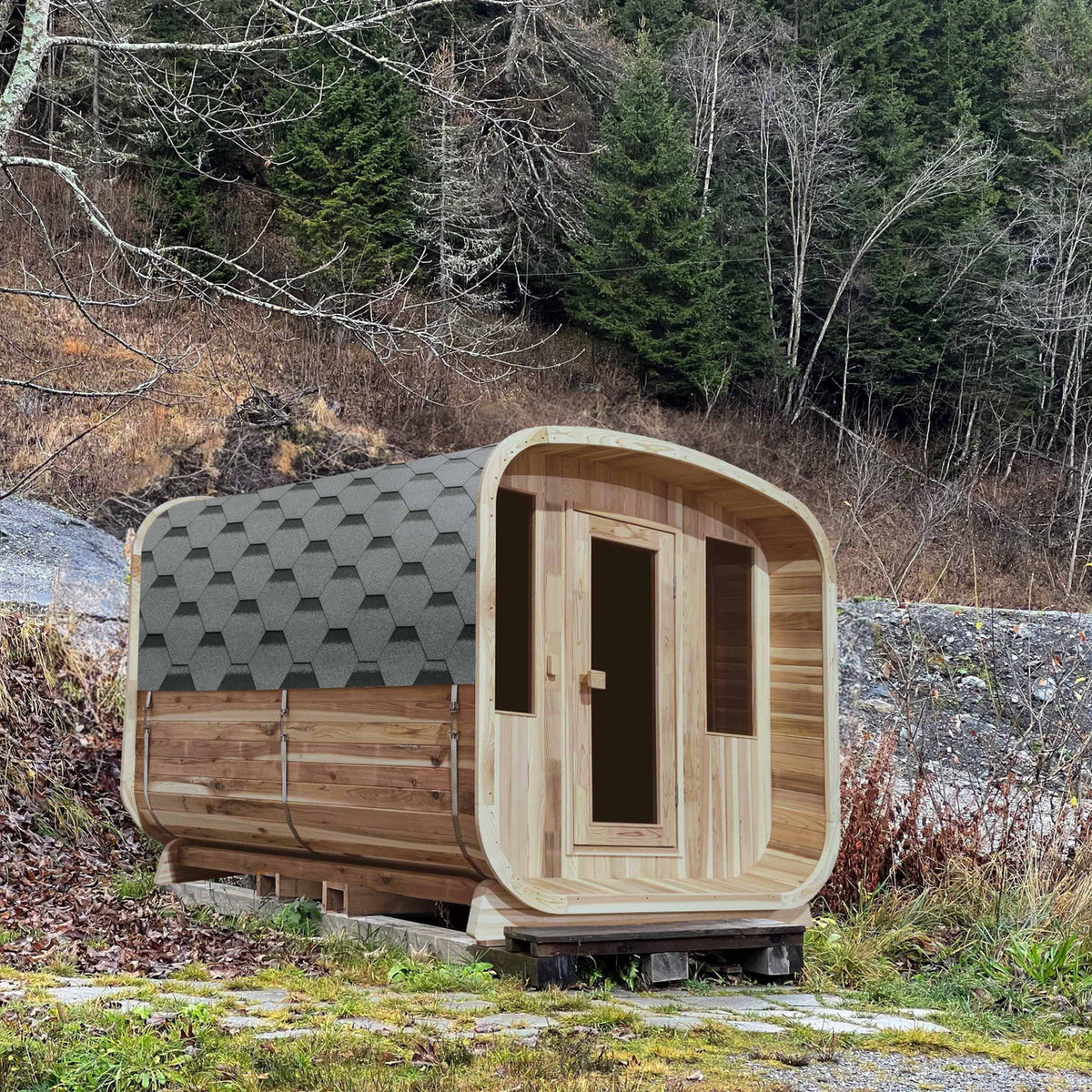 Aleko Rustic Cedar Square Outdoor Sauna 4 Person with 4.5 kW Electric Sauna Heater near a forest.