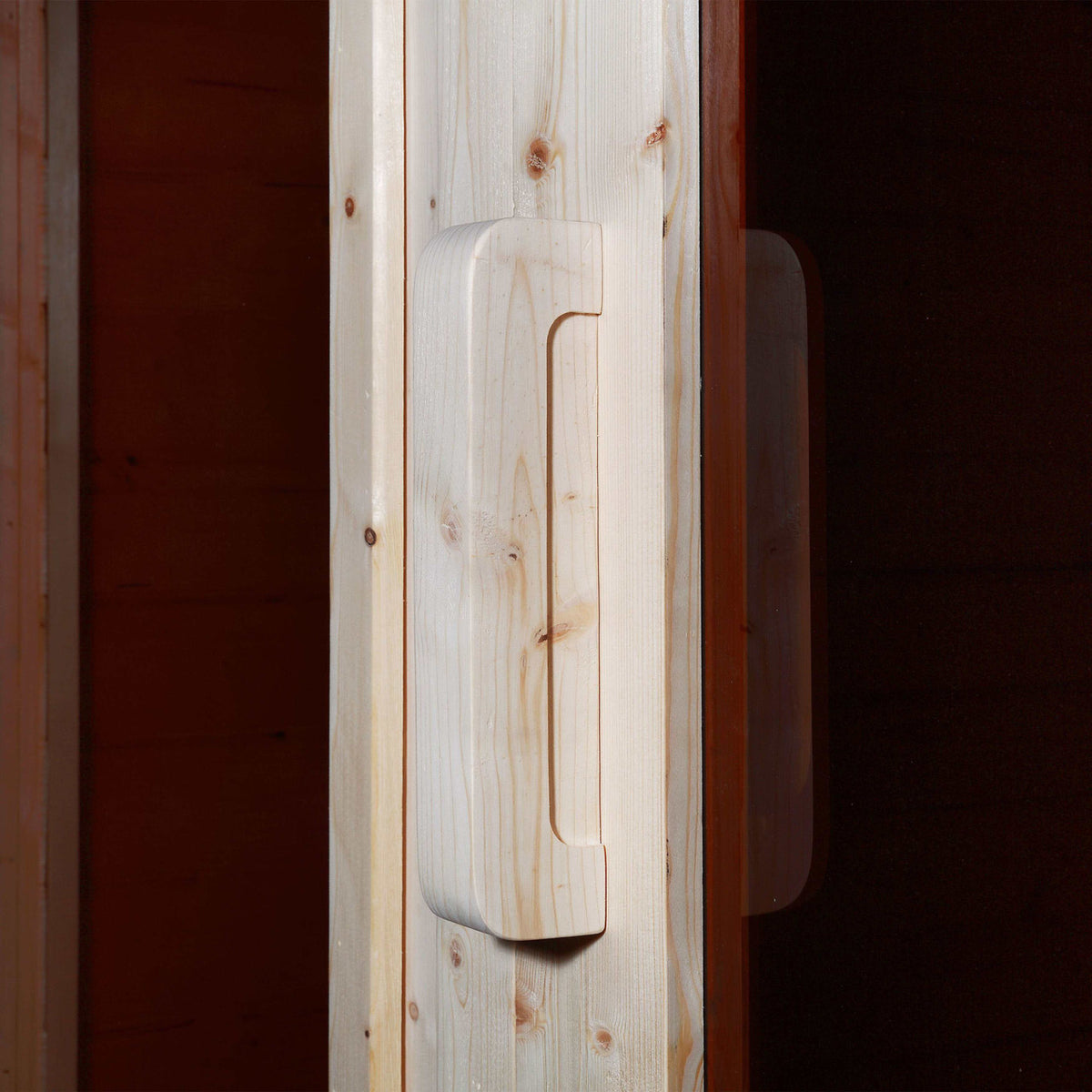 Close-up view of the door handle of Aleko White Finland Pine Wet/Dry 6/8 Person Outdoor Barrel Sauna with Front Porch Canopy and 8 kW Harvia KIP Electric Sauna Heater.