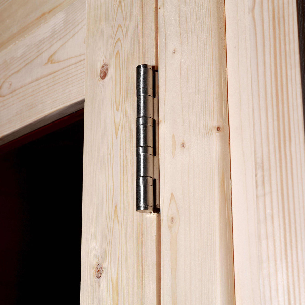 Door detail of Aleko White Finland Pine Wet/Dry 6/8 Person Outdoor Barrel Sauna with Front Porch Canopy and 8 kW Harvia KIP Electric Sauna Heater.