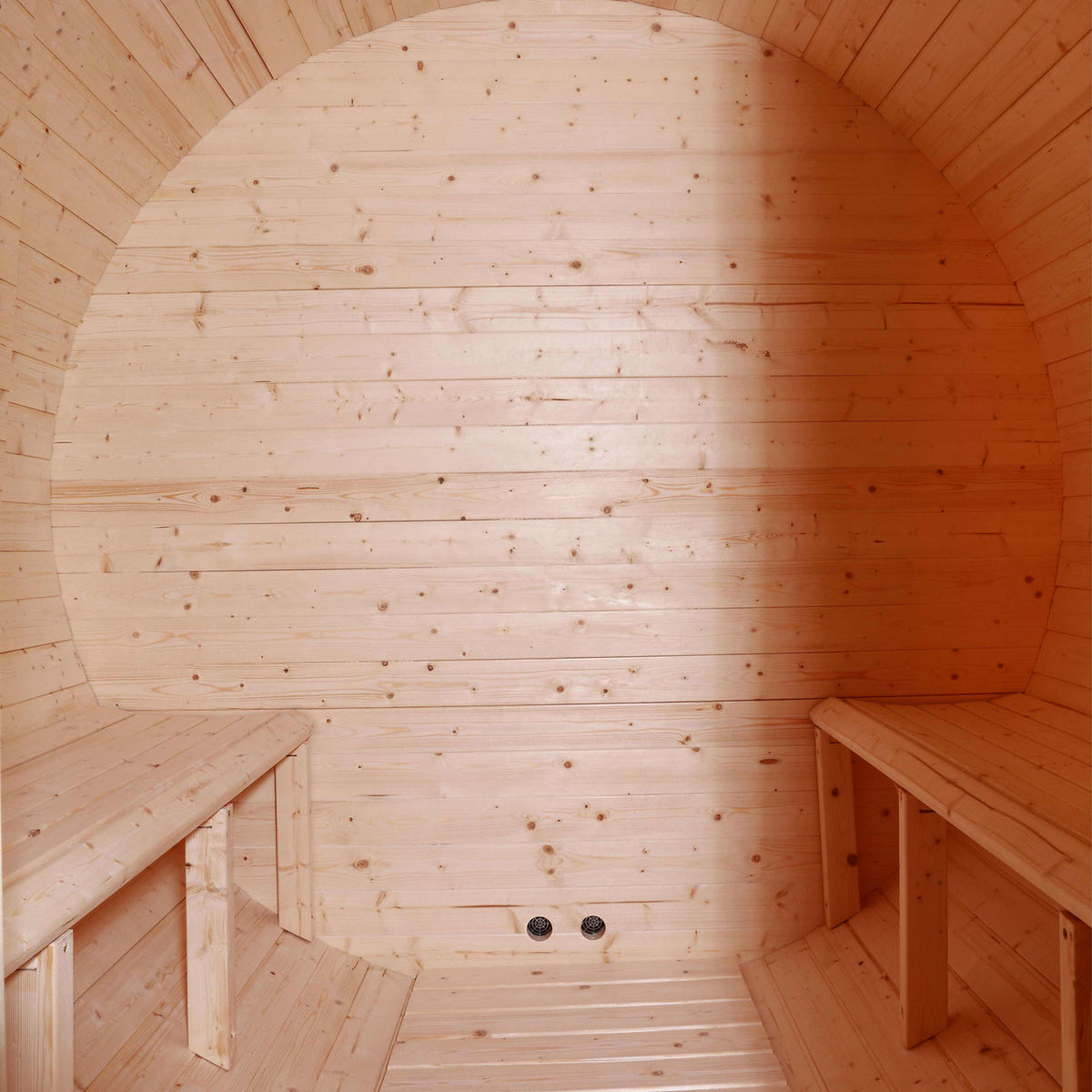 Interior view of Aleko White Finland Pine Wet/Dry 6/8 Person Outdoor Barrel Sauna with Front Porch Canopy and 8 kW Harvia KIP Electric Sauna Heater.