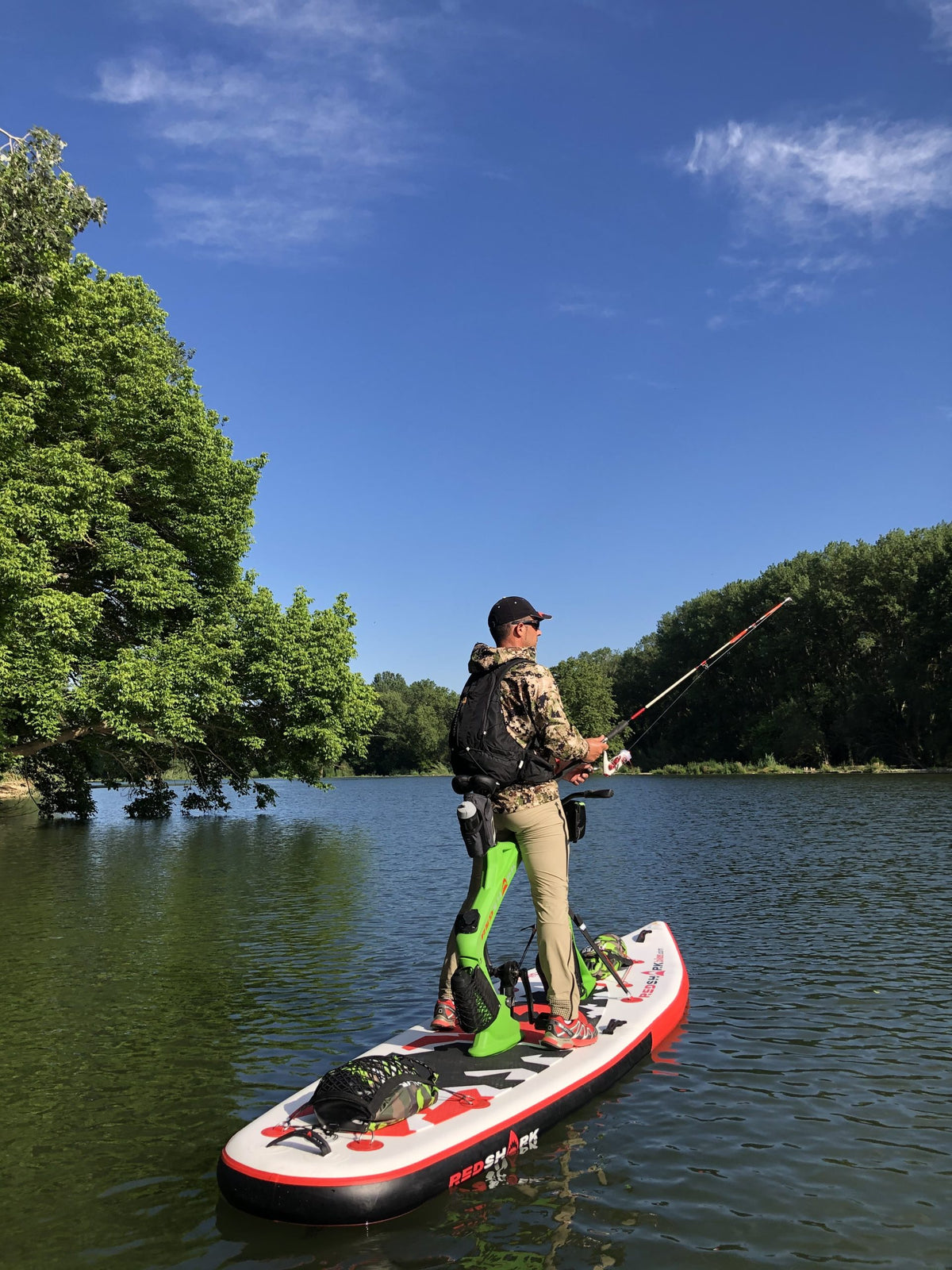 Angler using Red Shark Adventure Bike Surf for fishing on a sunny day.