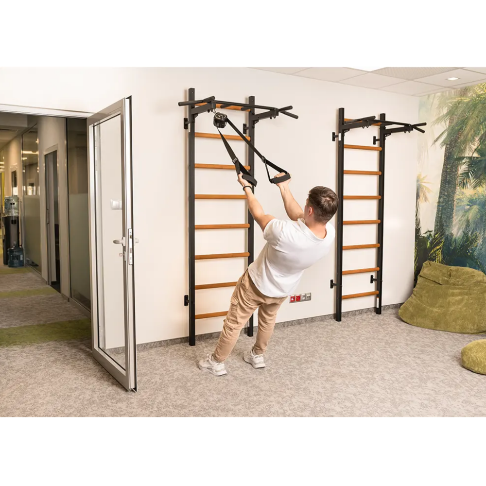 Set of two BenchK 221 Wall Bars and Gymnastic Ladders black version installed in a yoga studio.