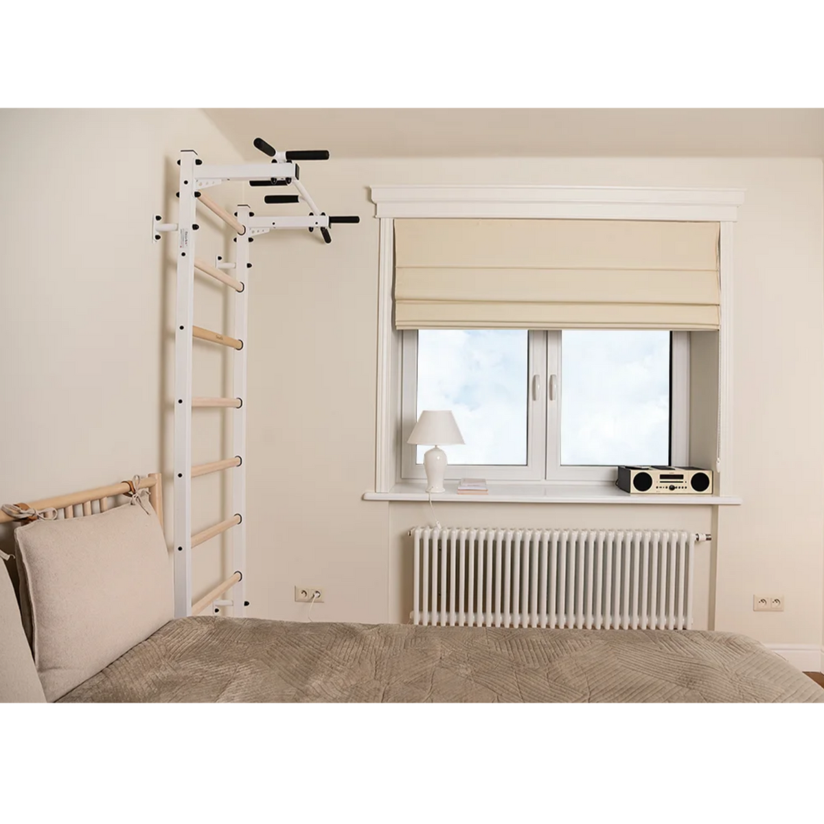 Side view of BenchK 221 Wall Bars and Gymnastic Ladders white version installed in a bedroom.