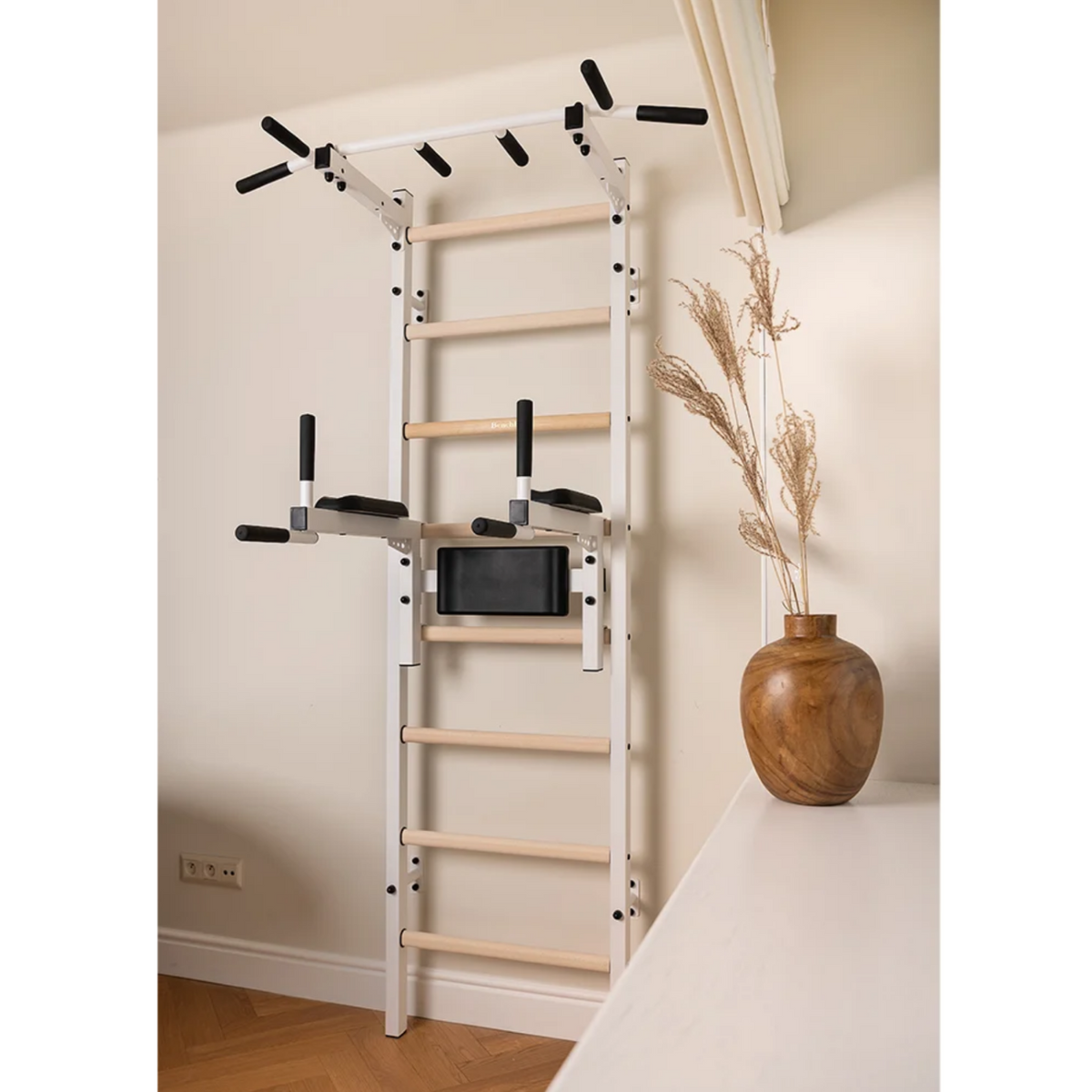 BenchK 222 Wall Bars and Gymnastic Ladders white version installed in a living room.