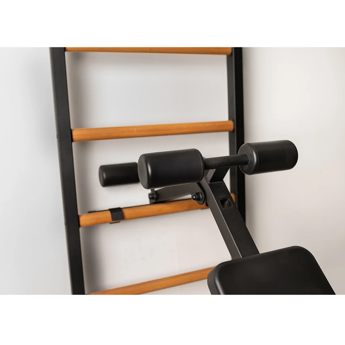 Close-up view of workout bench of BenchK 223 Wall Bars &amp; Gymnastic Ladders black version.