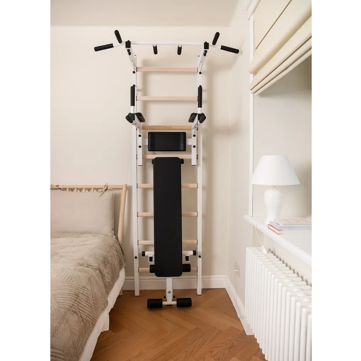 Front view of BenchK 223 Wall Bars &amp; Gymnastic Ladders white version in a bedroom.