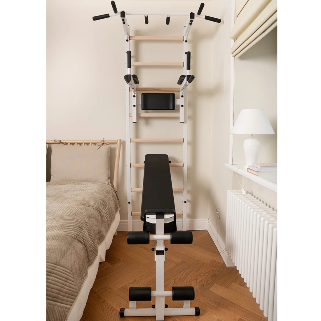 Front view of BenchK 223 Wall Bars &amp; Gymnastic Ladders white version in a bedroom.