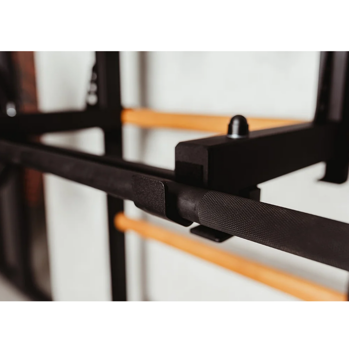 Close-up view of barbell holder of BenchK 231 Wall Bars &amp; Gymnastic Ladders black version.