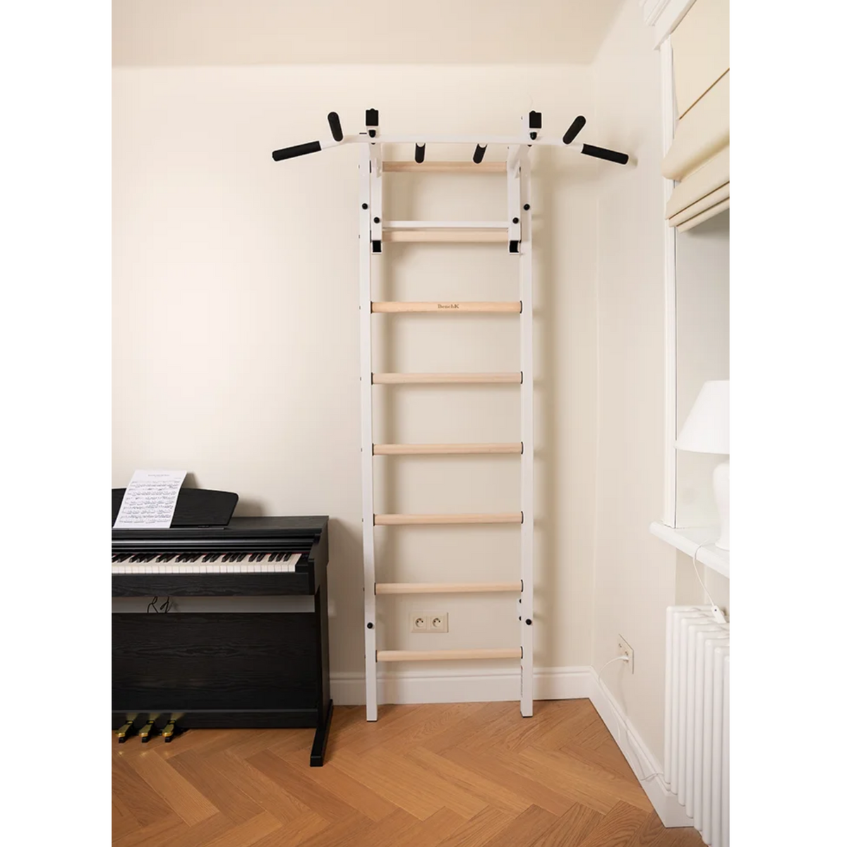 BenchK 231 Wall Bars &amp; Gymnastic Ladders white version in a living room.