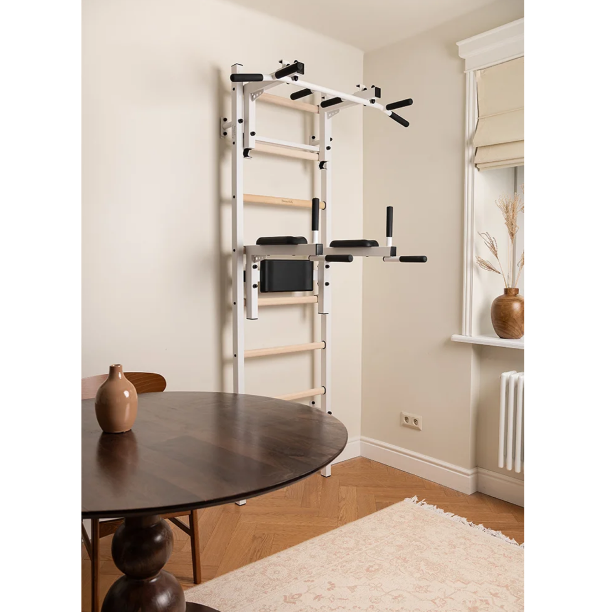 Side view of BenchK 232 Wall Bars &amp; Gymnastic Ladders white version in a living room.