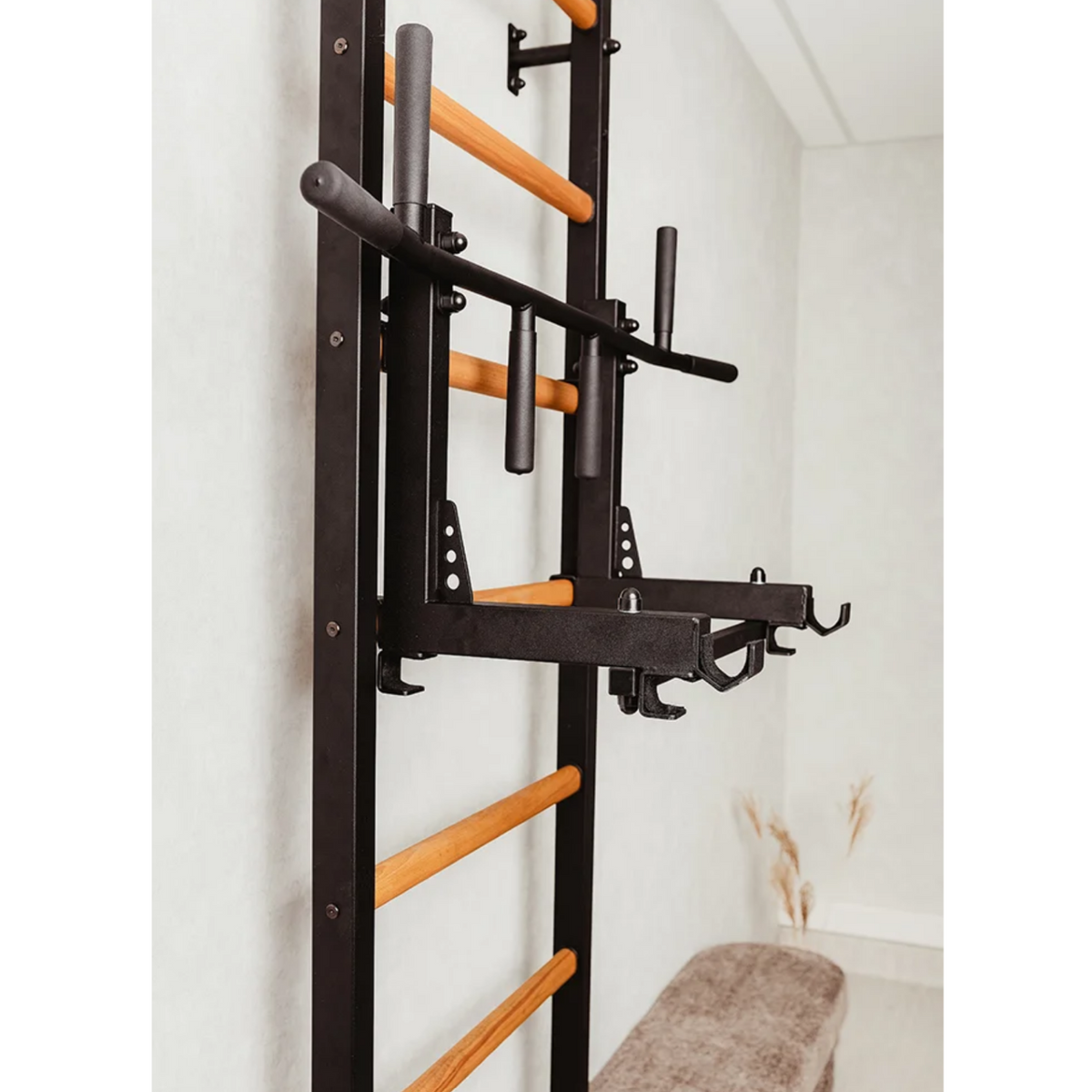 Close-up view of pull-up bar with barbell holder of BenchK 233 Wall Bars and Gymnastic Ladders black version.