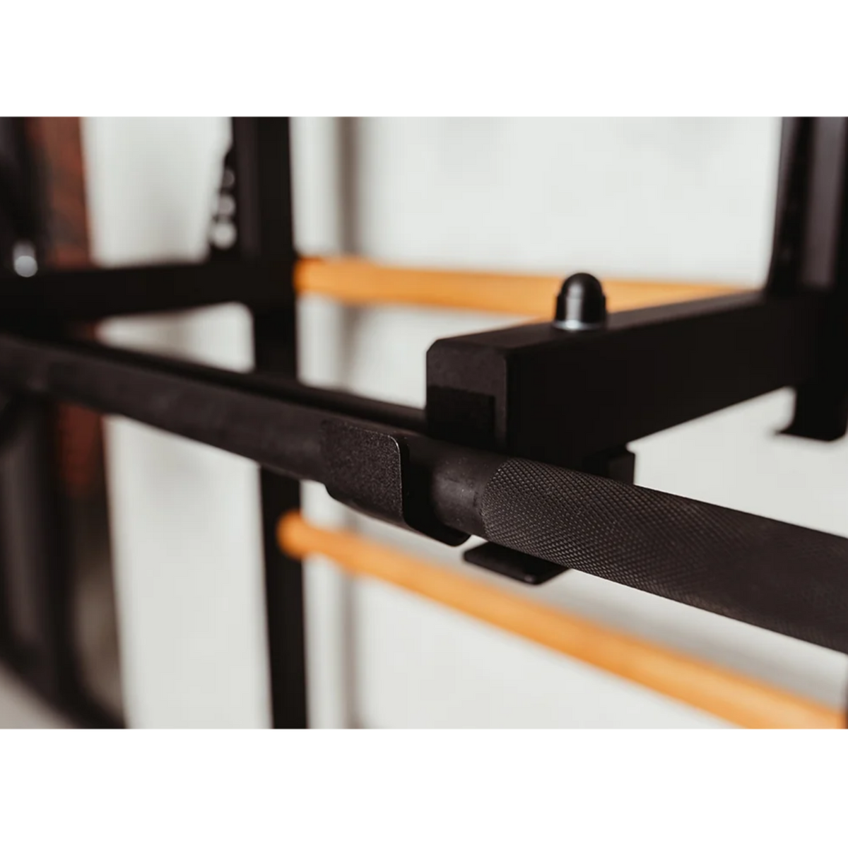 Close-up view of barbell holder of BenchK 233 Wall Bars and Gymnastic Ladders black version.