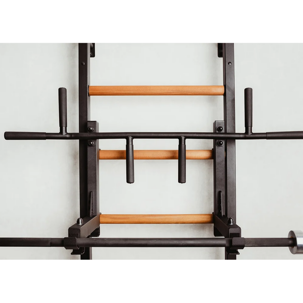 Close-up view of pull-up bar with barbell holder of BenchK 233 Wall Bars and Gymnastic Ladders black version.