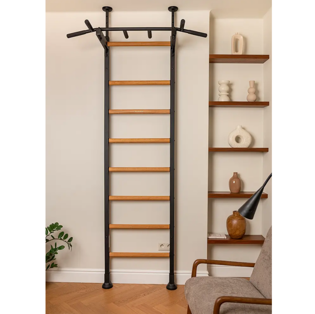 Front view of BenchK 521 Wall Bars and Gymnastic Ladders black version with pull-up bar installed in a living room.