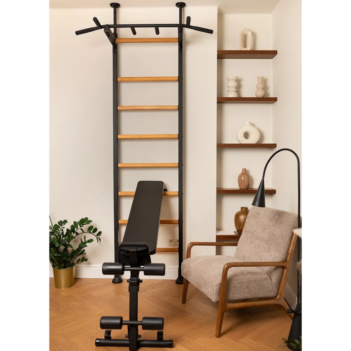 BenchK 523 Wall Bars and Gymnastic Ladders black version with pull-up bar and workout bench installed in a living room.