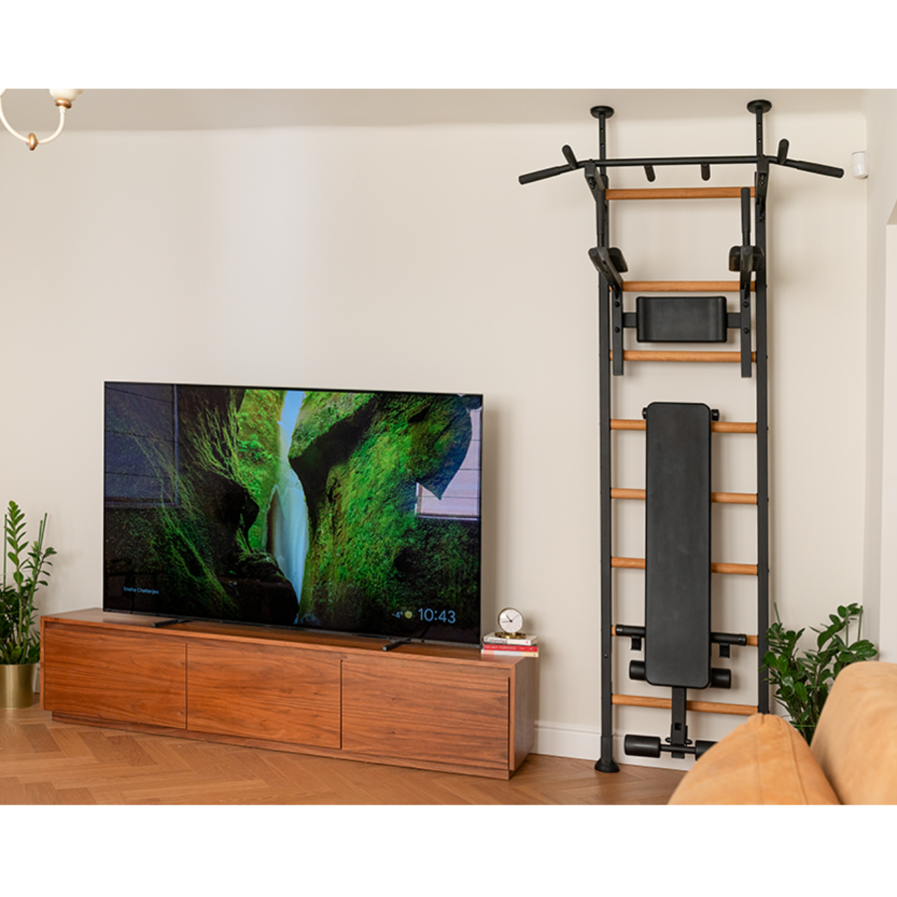 BenchK 523 Wall Bars and Gymnastic Ladders black version installed in a living room.