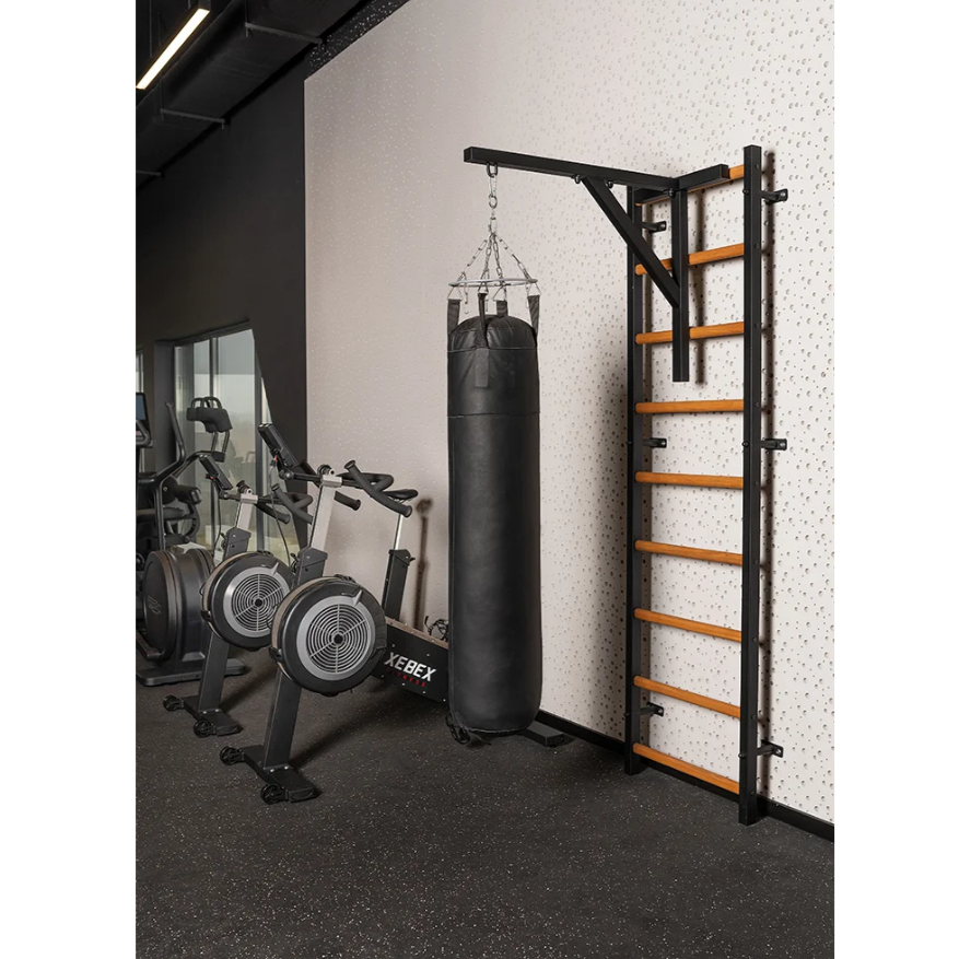 BenchK BBH Punching Bag Holder black version with punching bag installed in a gym.