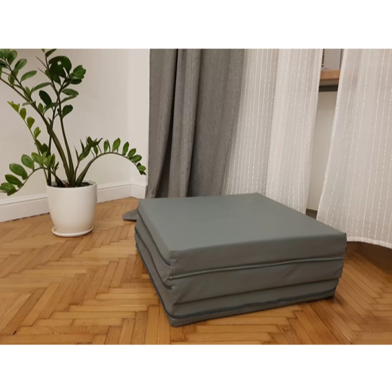 BenchK Foldable Gymnastic Mattress gray version in a living room.