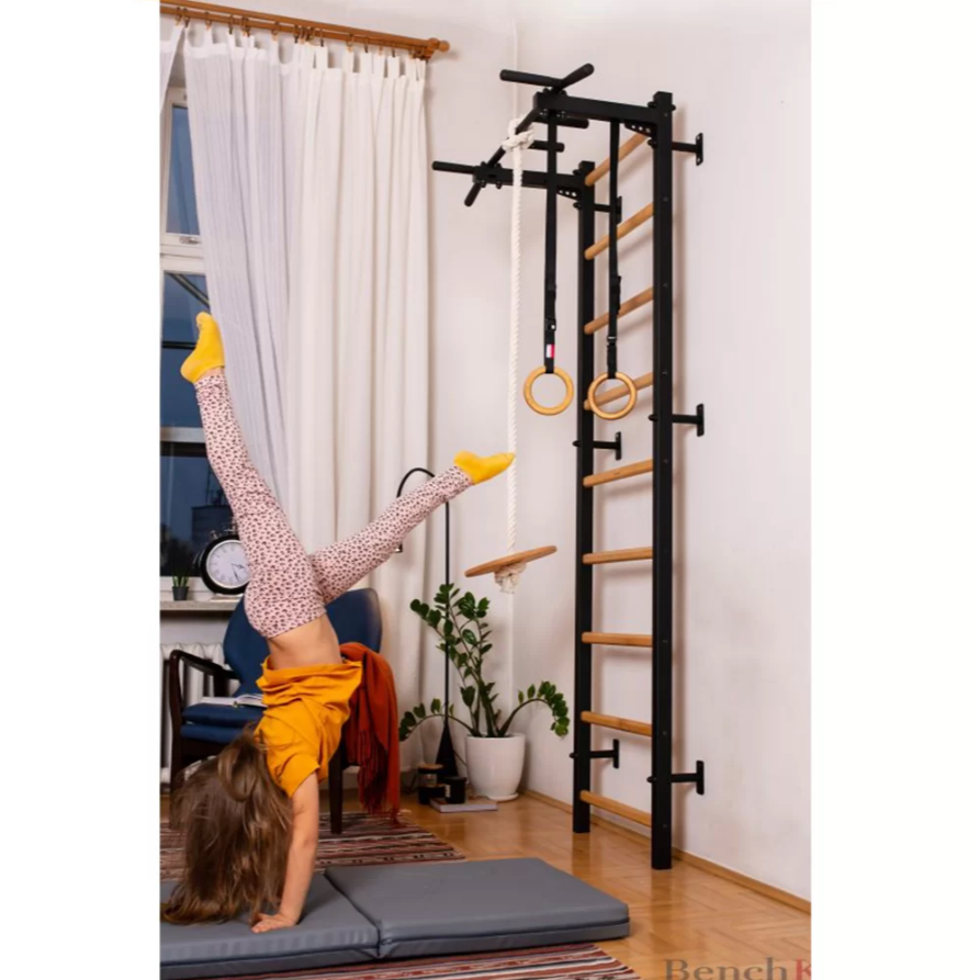 A child playing with a BenchK Foldable Gymnastic Mattress gray version.