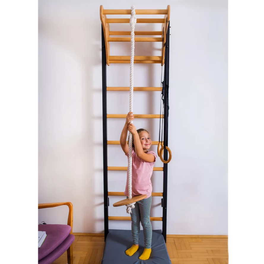 A child playing with BenchK Gymnastic Accessories oak version.