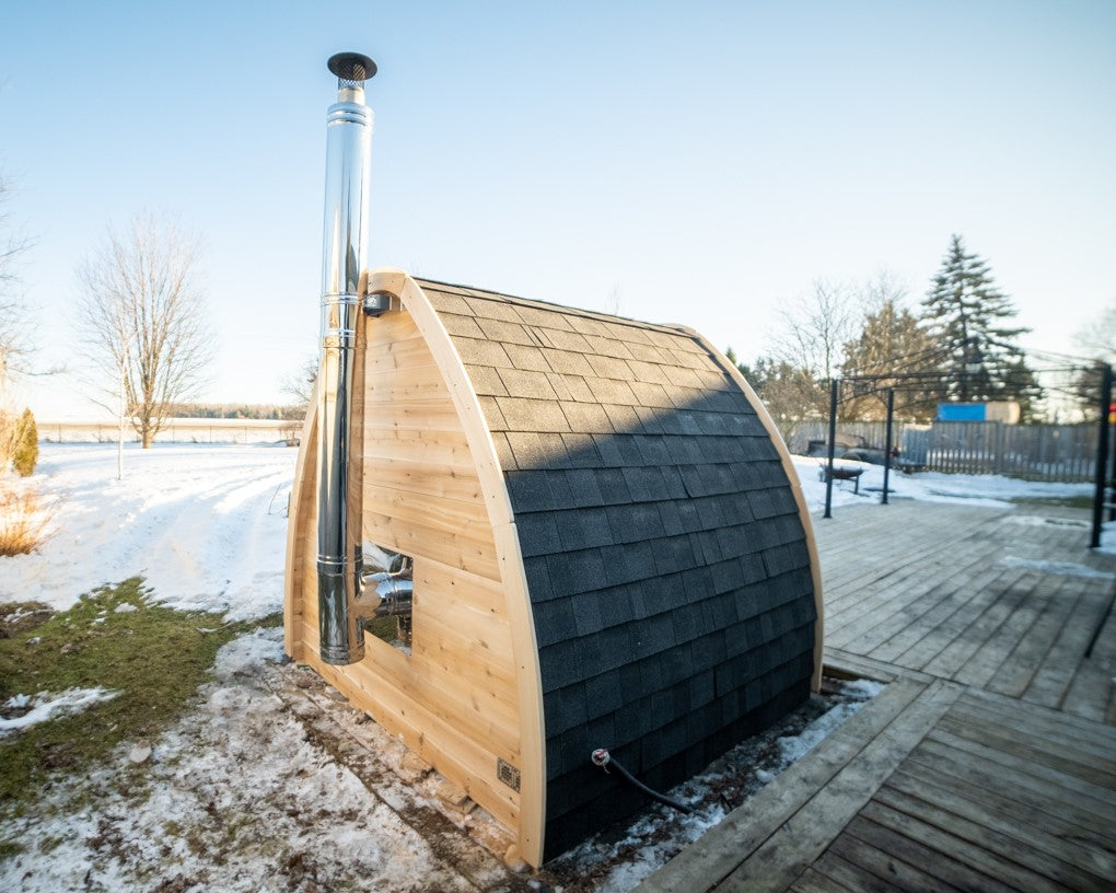 Back view of MiniPOD Outdoor Sauna, showing its compact design and chimney. 