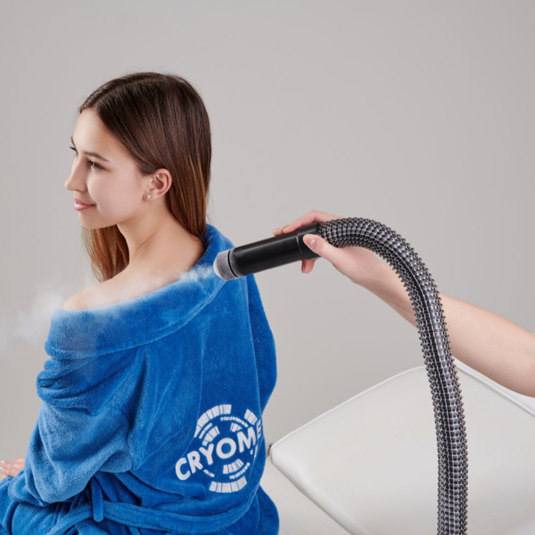 A woman during a local cryotherapy session with Cryomed CF-04 Cryofan.