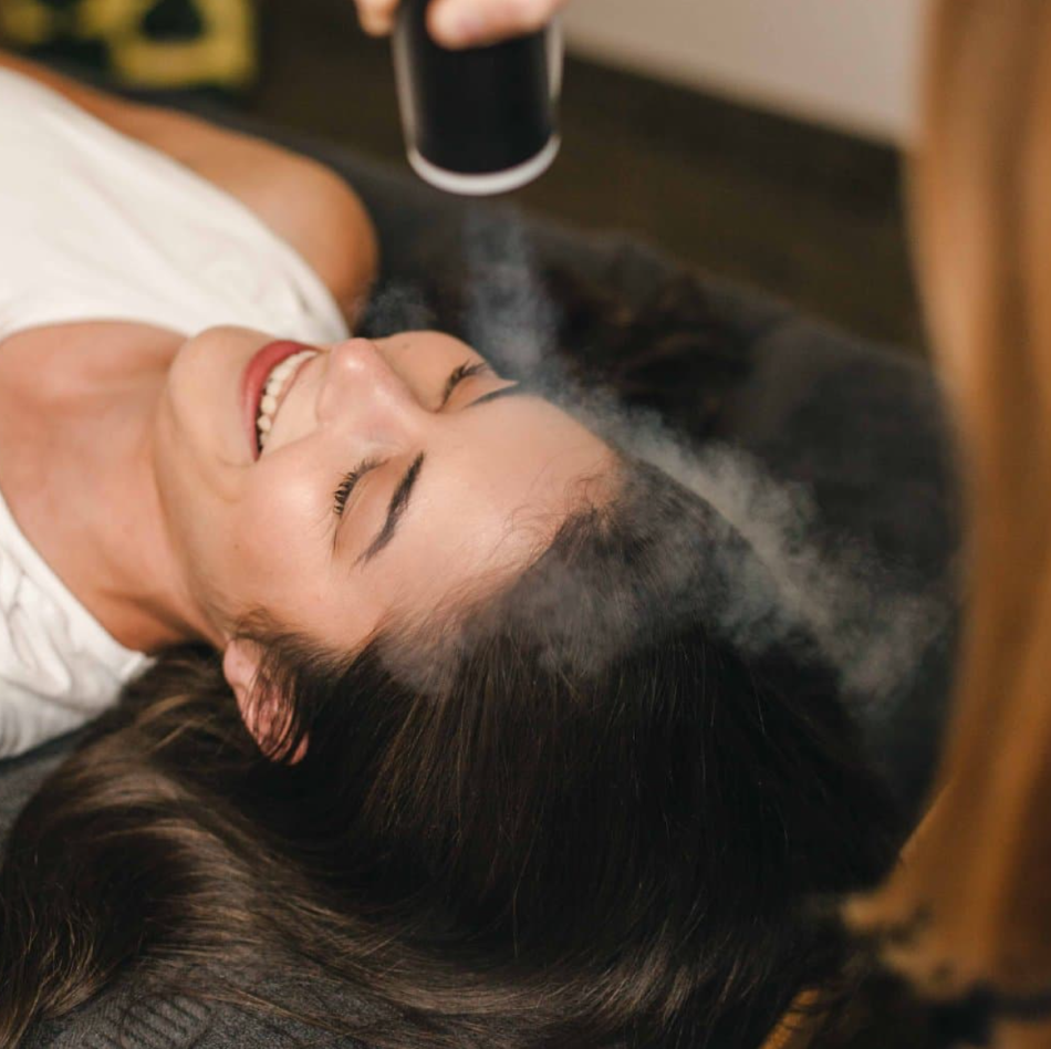 A woman enjoying a cryofacial session with Cryomed CF-04 Cryofan.