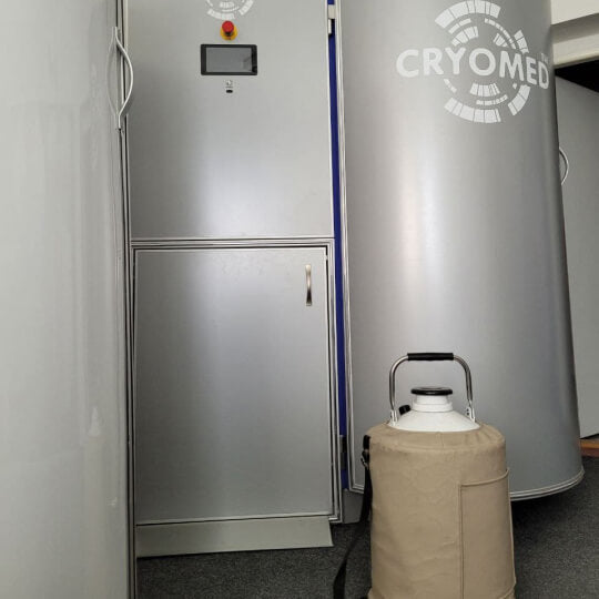 A Cryomed Non-Pressurized Dewar Nitrogen Tank ready to be installed in a cryotherapy device.