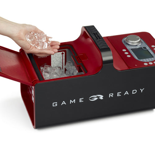 A person pouring ice into a Game Ready GRPro 2.1 Cold and Compression Therapy Unit.