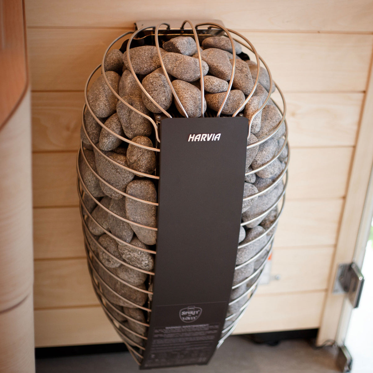 Harvia Spirit Electric Sauna Heater installed in a wooden sauna room, highlighting the sleek design.