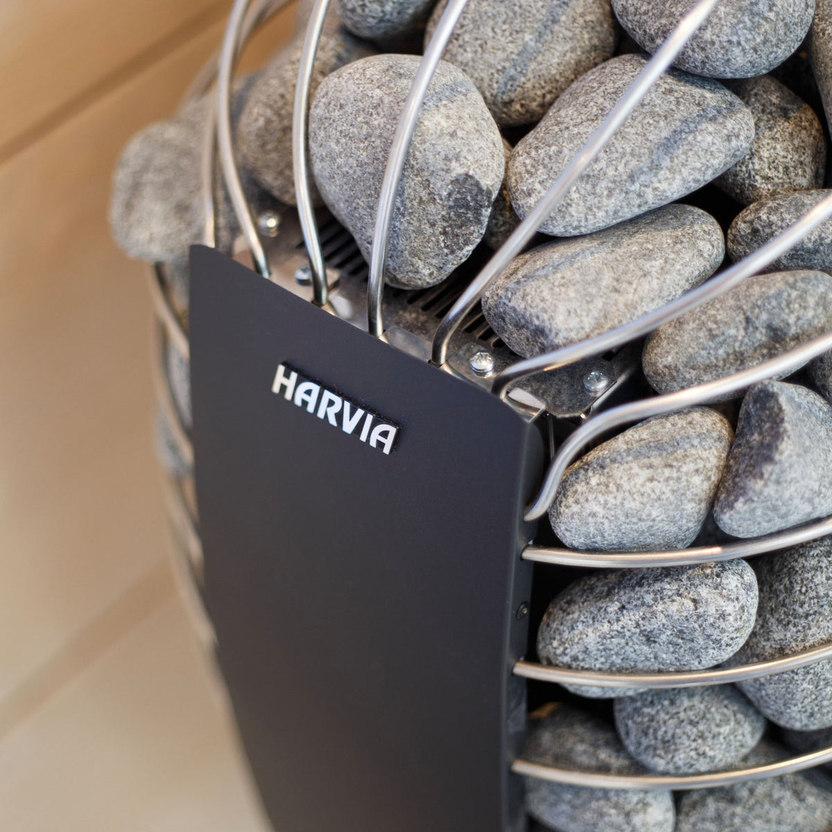 Side view of the Harvia Spirit Electric Sauna Heater, showcasing the stone-filled design.