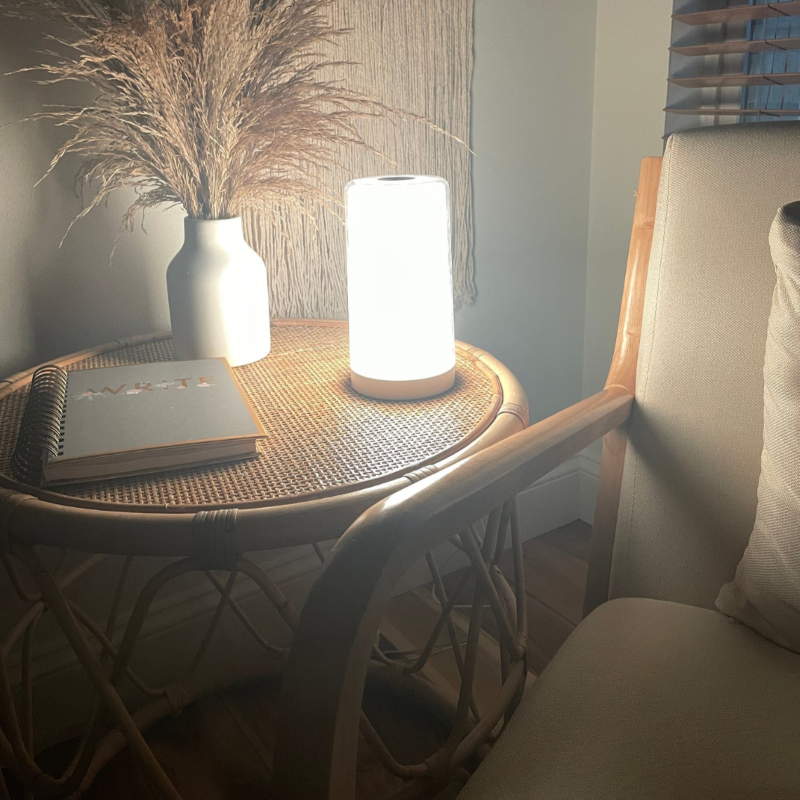 Hooga Green Light Therapy Migraine Relief Lamp being used in a living room.