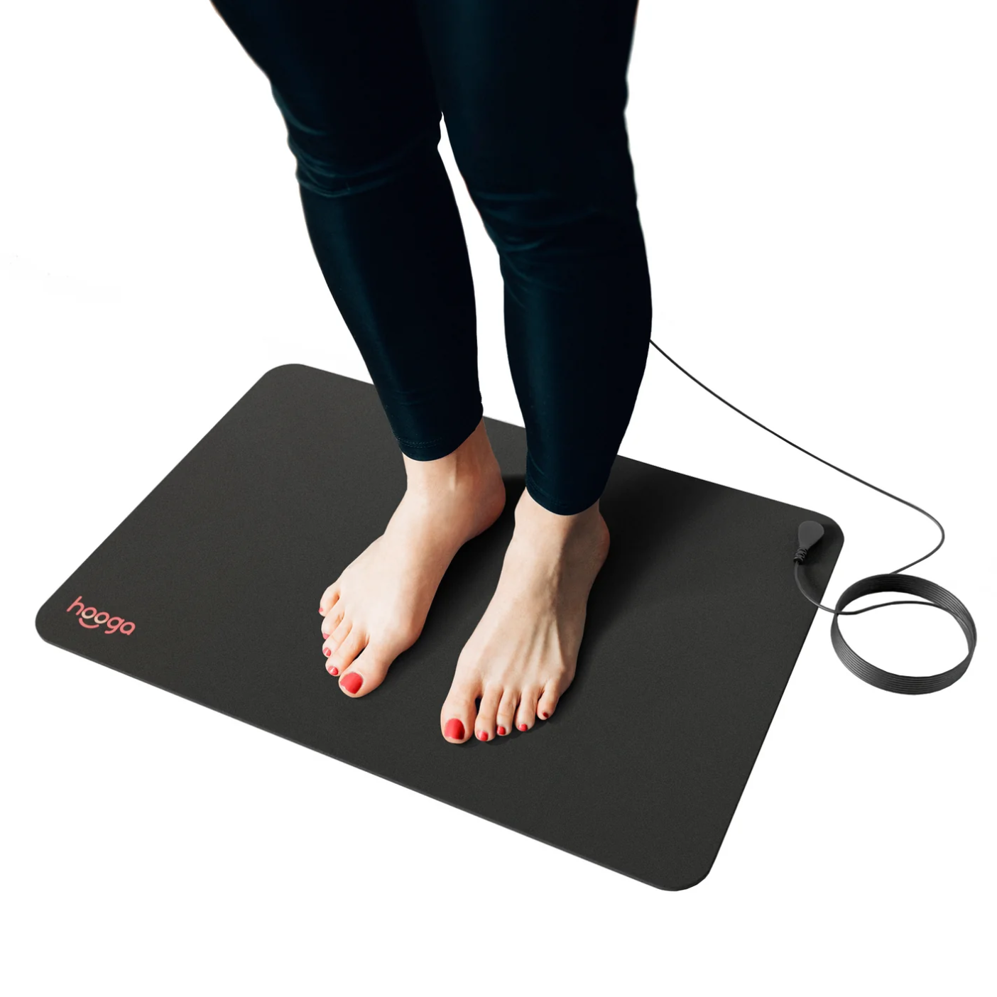 A woman using a Hooga Grounding Mat.