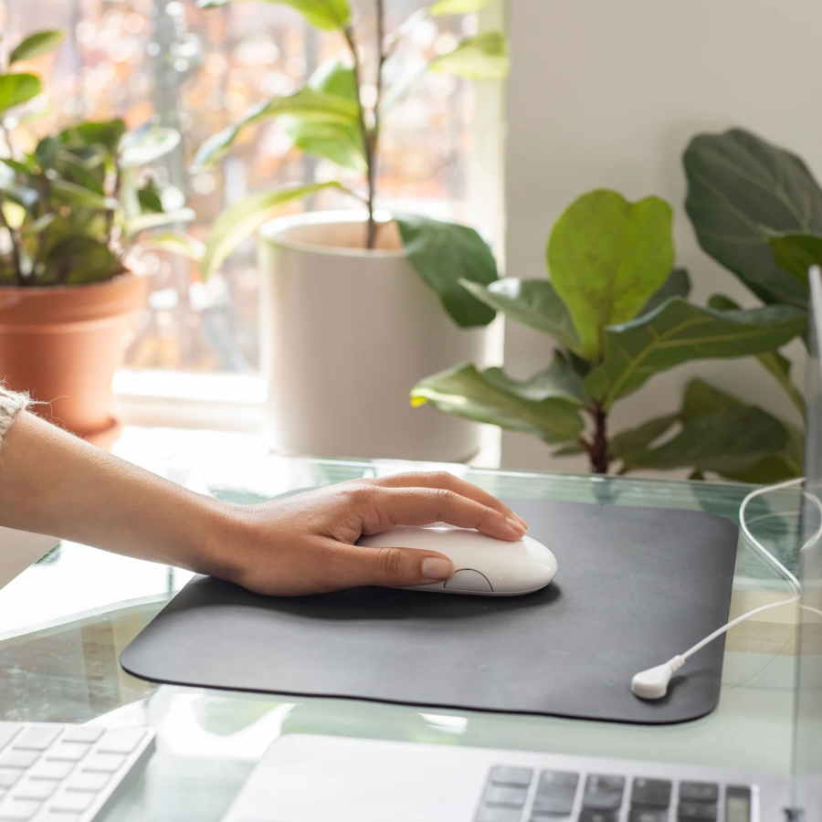 A person using a Hooga Grounding Mouse Pad.