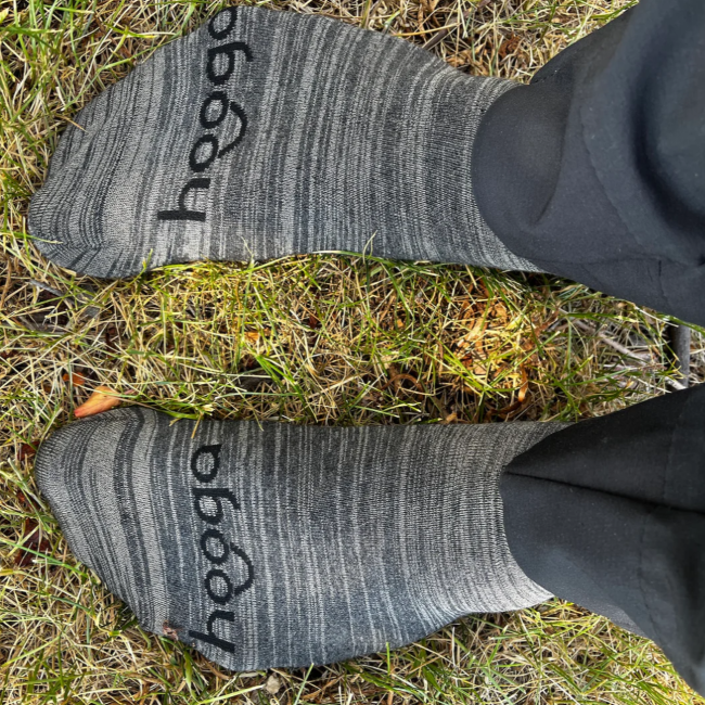 A person using Hooga Grounding Socks outdoors.