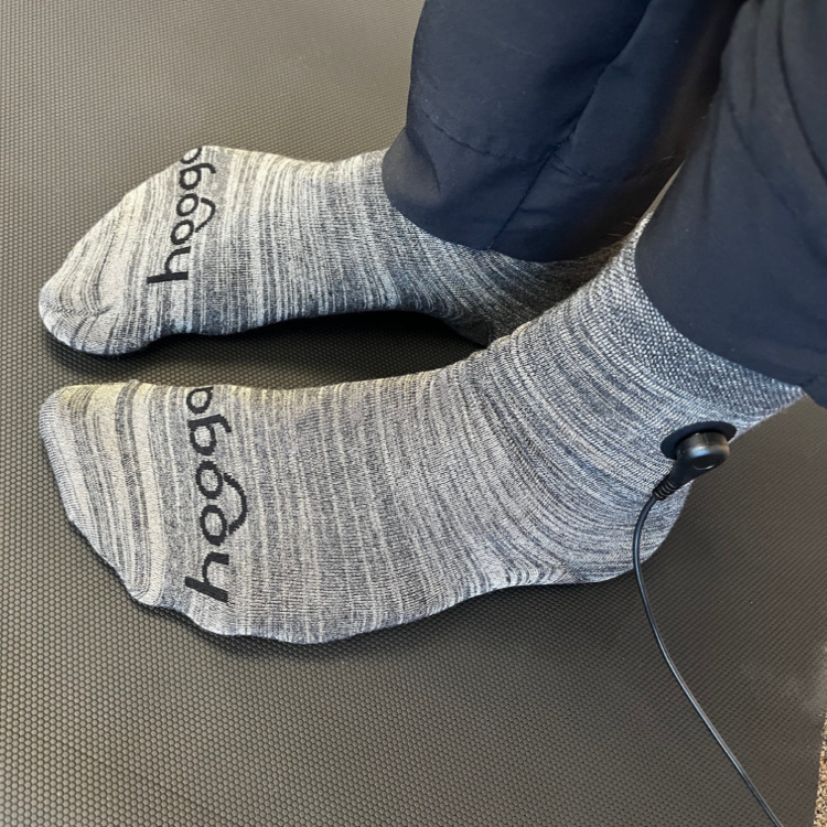 A person using Hooga Grounding Socks.