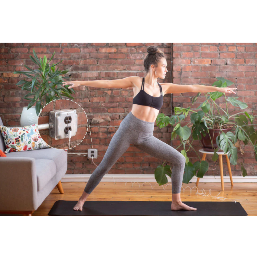 A woman using a Hooga Grounding Yoga Mat.