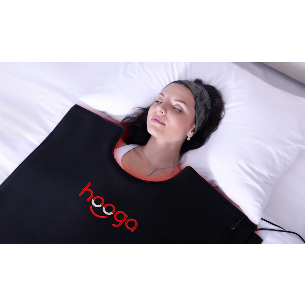 A woman using a Hooga Red Light Therapy Full Body Pod.