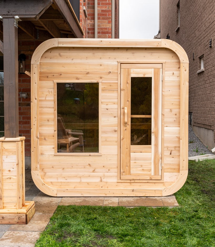 Front view of Leisurecraft Canadian Timber Luna Outdoor Sauna in an outdoor setting.