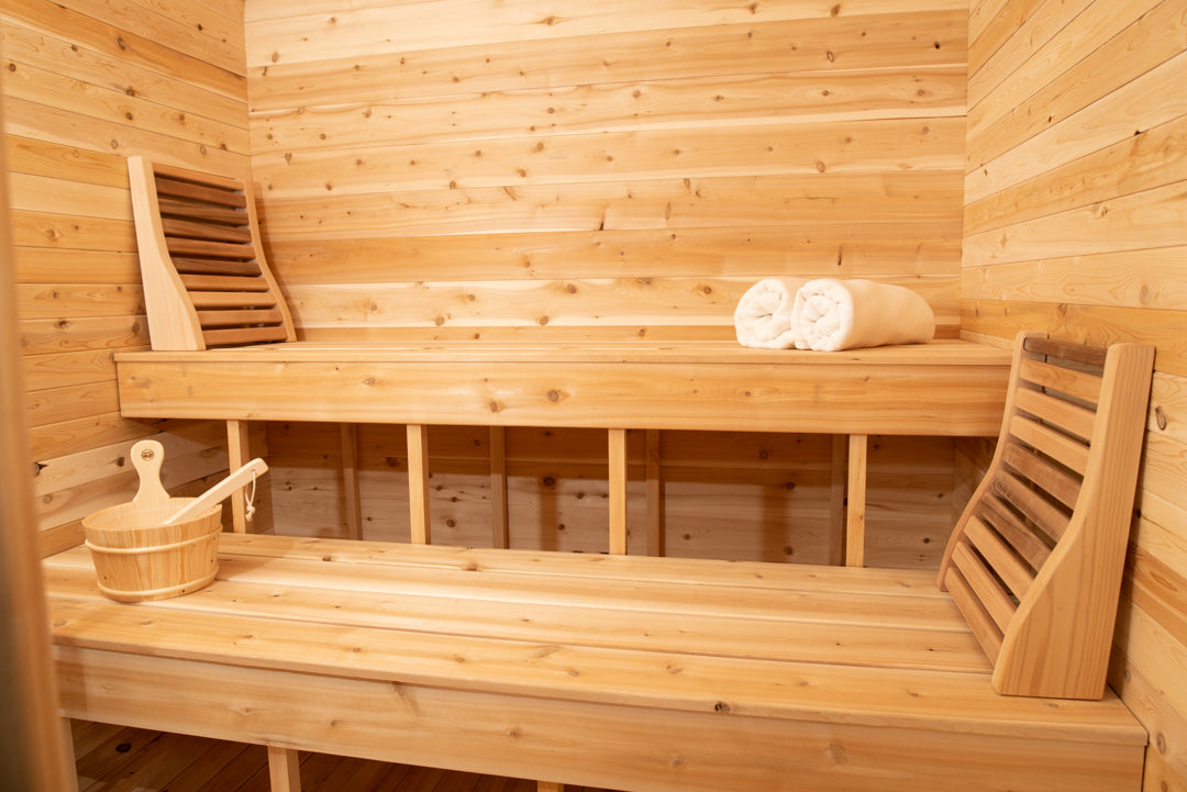 Close-up view of the benches of Leisurecraft Canadian Timber Luna Outdoor Sauna.