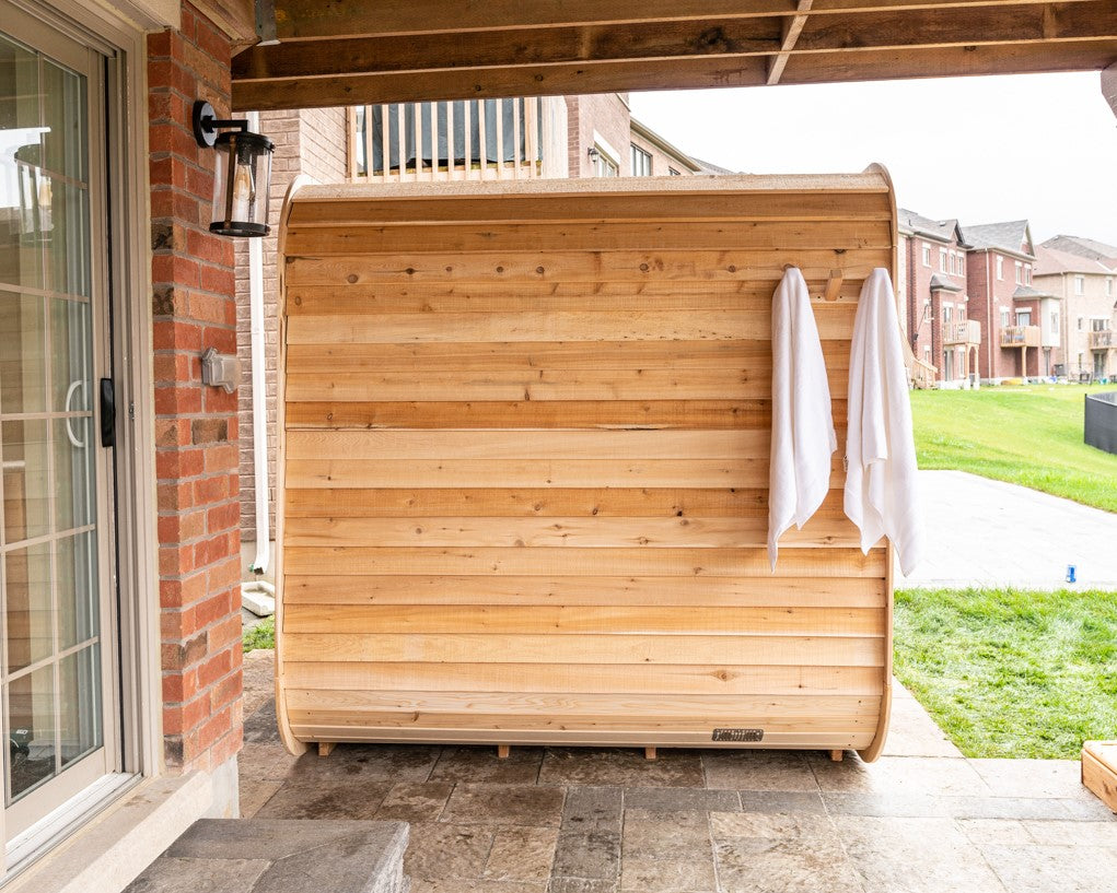 Side view of Leisurecraft Canadian Timber Luna Outdoor Sauna in an outdoor setting.