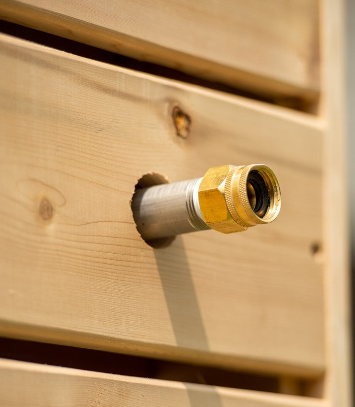 Close-up view of water supply connector of Leisurecraft Canadian Timber Sierra Outdoor Shower.