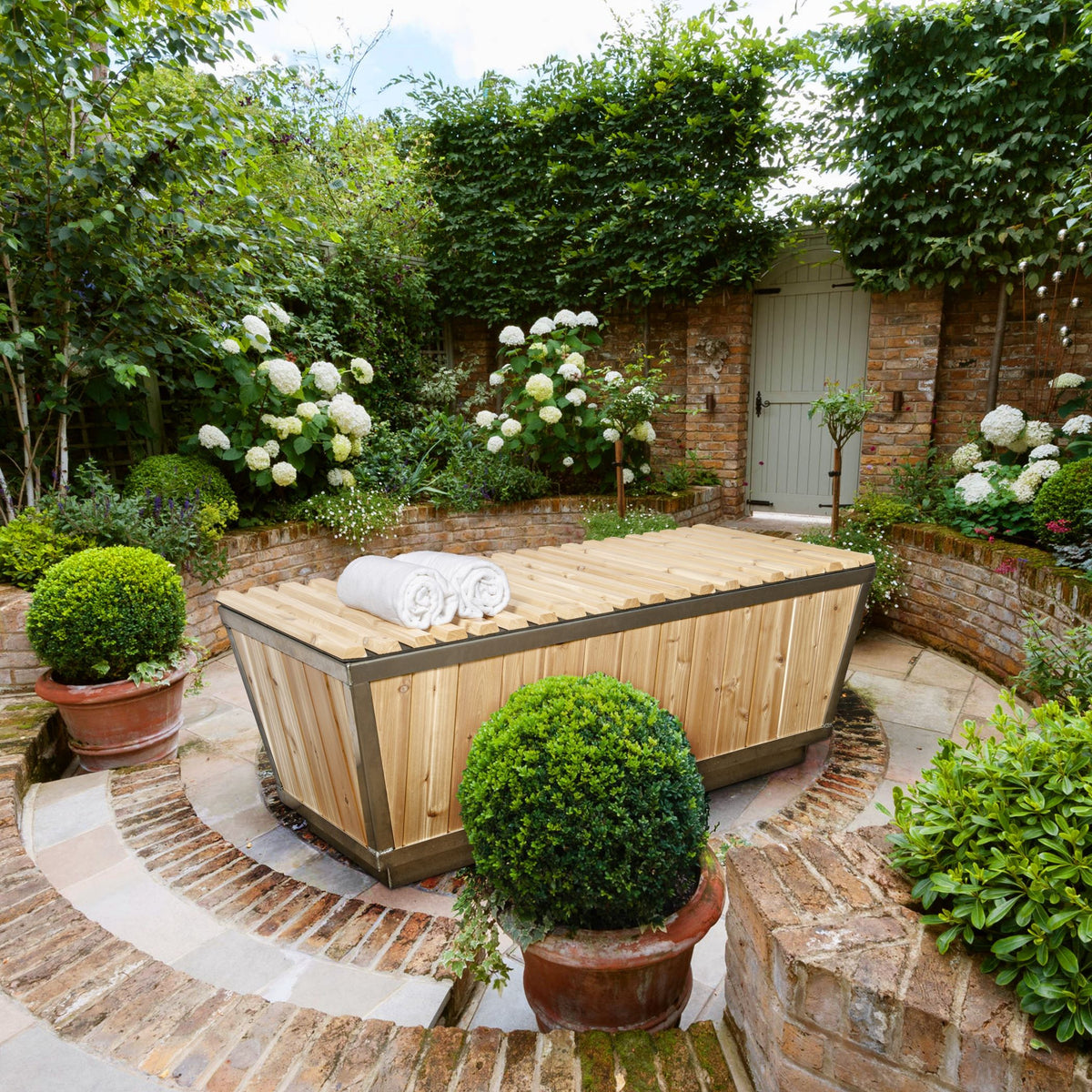 Leisurecraft Canadian Timber Polar Cold Plunge Tub in an outdoor setting with the protective cover on.