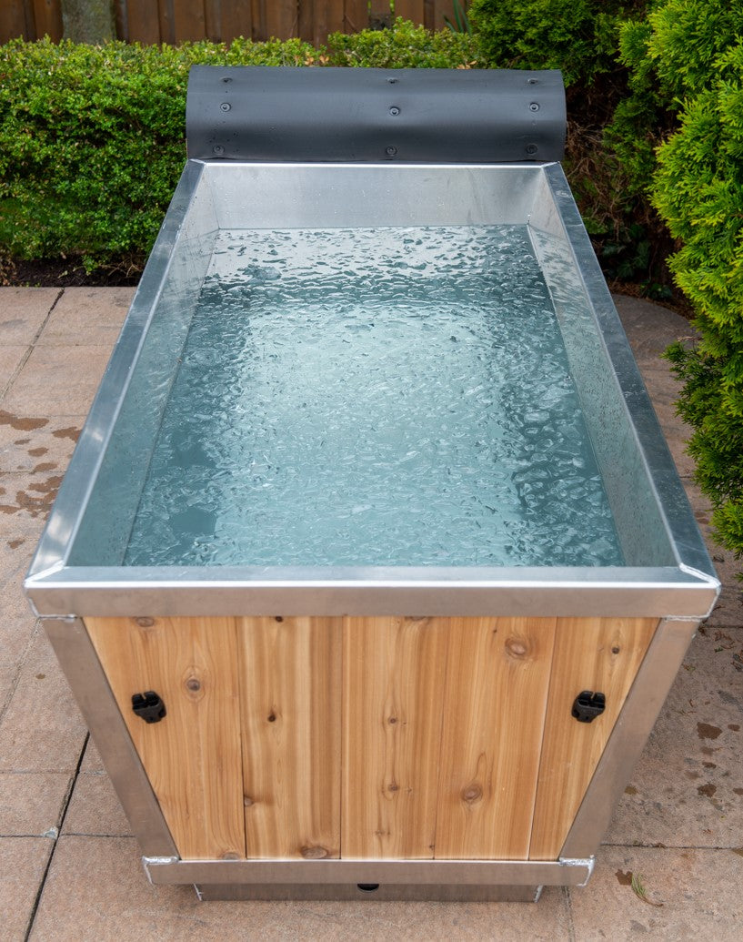 Leisurecraft Canadian Timber Polar Cold Plunge Tub filled with iced water, ready to be used in a cold therapy session.