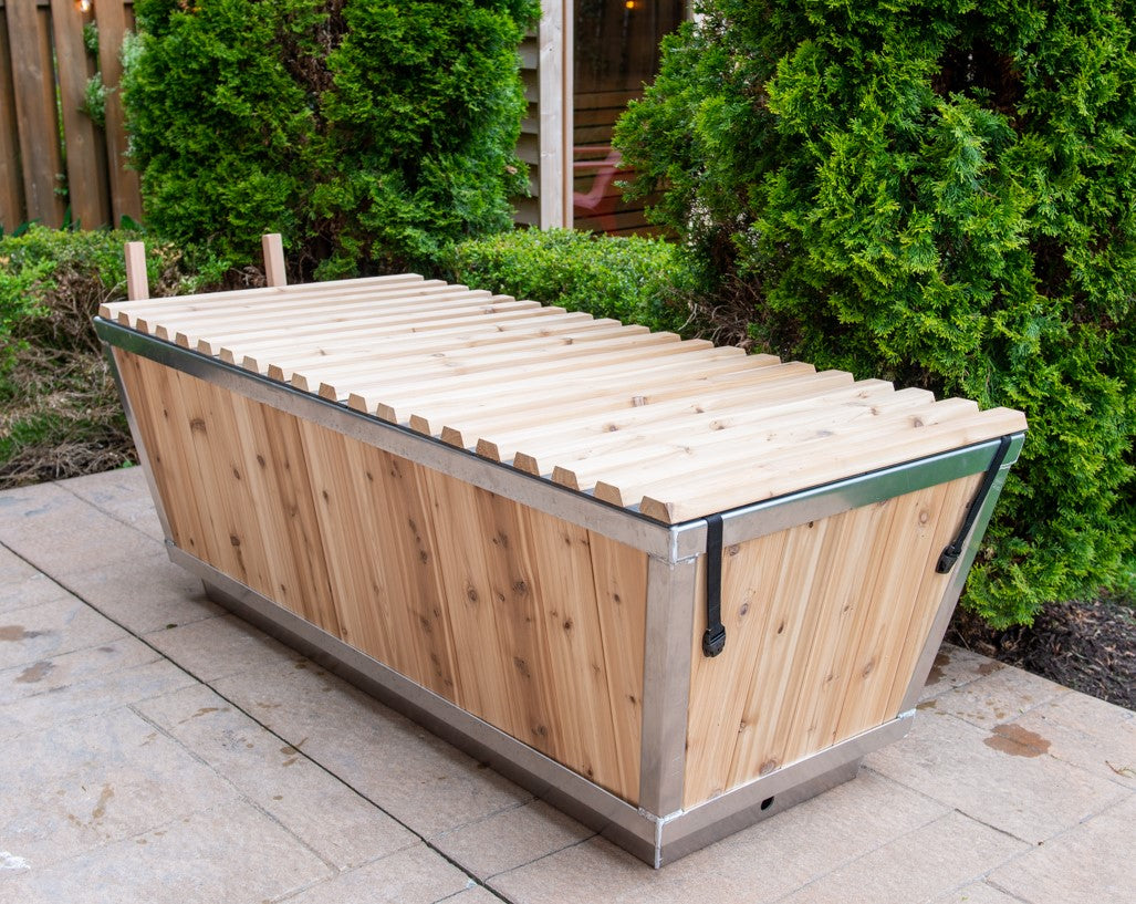 Leisurecraft Canadian Timber Polar Cold Plunge Tub with its protective cover on in an outdoor setting.