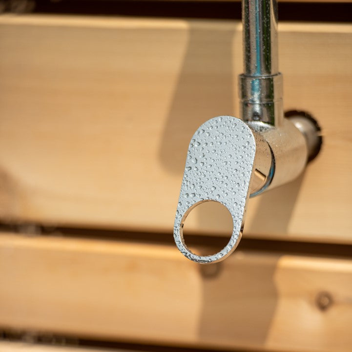 Close-up view of the switch of Leisurecraft Canadian Timber Savannah Outdoor Shower.