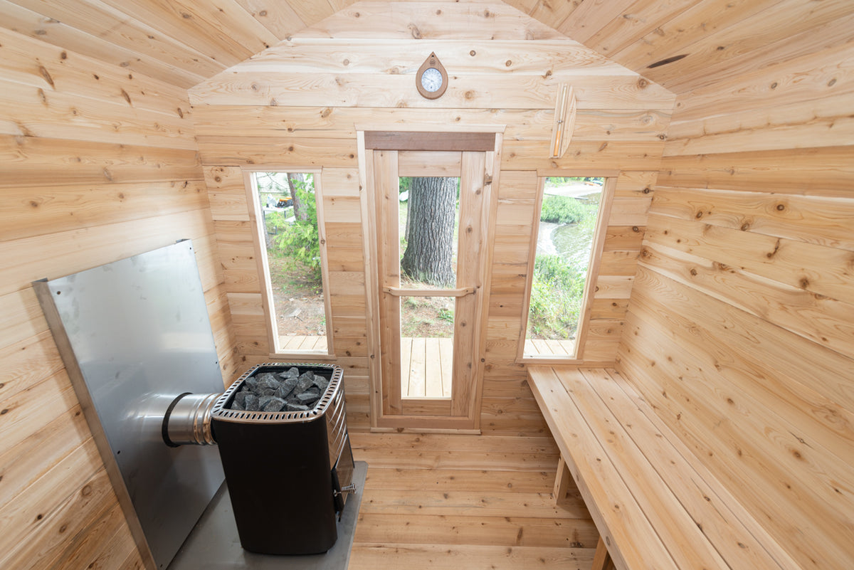 Interior view of Georgian Cabin Outdoor Sauna, showings its spacious and luminous designs due to its tempered glass windows.