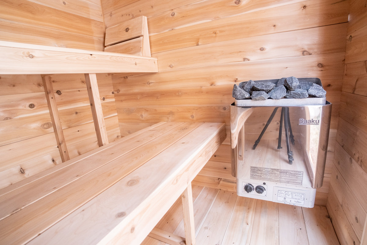 Close-up view of an electric heater inside a Leisurecraft Canadian Timber Granby Cabin Outdoor Sauna.